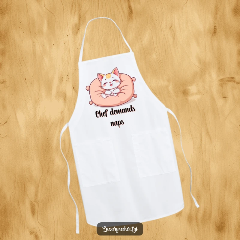 Funny apron showing a happy cat character lounging on a plush, oversized velvet cushion, perfect for charming and comfortable kitchen tasks.