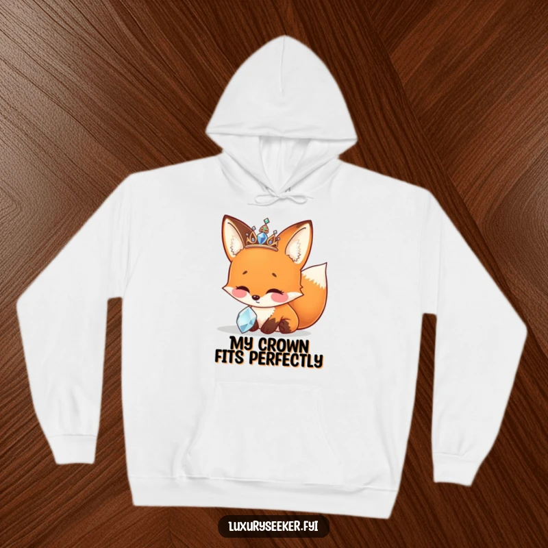 Funny Hoodie featuring a cheerful fox with a sparkly tiara, mesmerized by a glittering jewel.