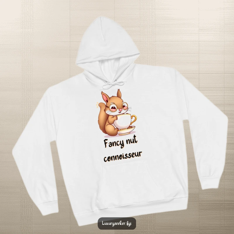Funny hoodie featuring a cheerful squirrel with a tiny monocle, gracefully sipping from a miniature golden teacup, offering cozy elegance.