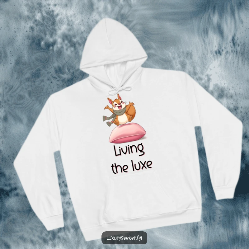 Funny hoodie: An excited squirrel with a designer scarf leaping onto a plush velvet cushion, embodying playful luxury.