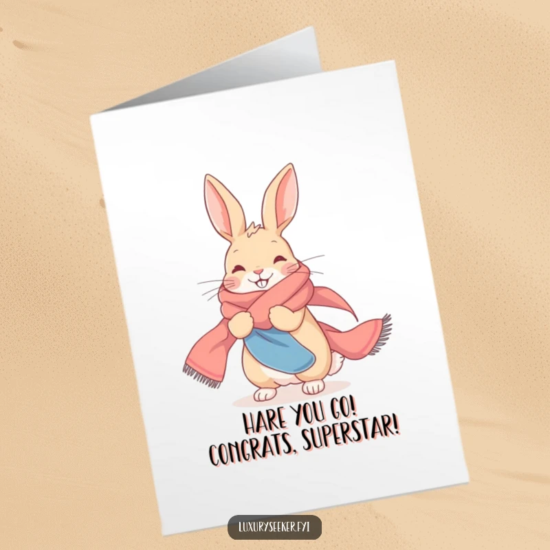 Funny free printable congratulations card showing a delighted rabbit making a grand entrance wrapped in a luxurious silk scarf.