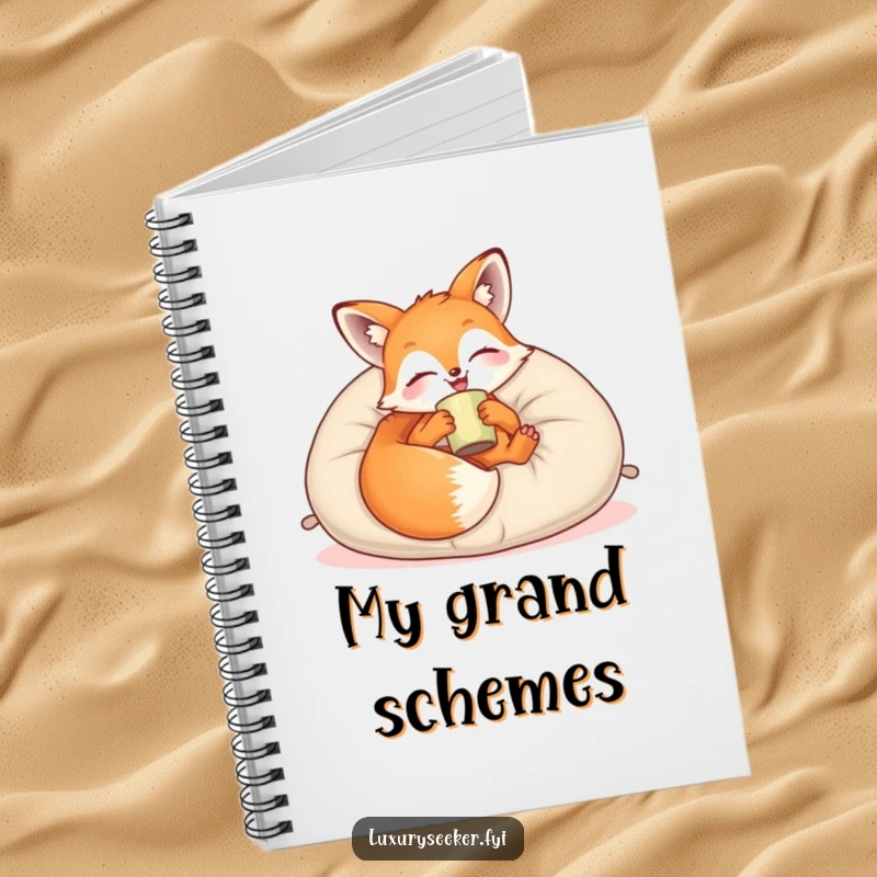 Funny Notebook: A joyful fox lounges on a plush velvet pillow with a cup, ideal for note-taking with a touch of relaxed charm.