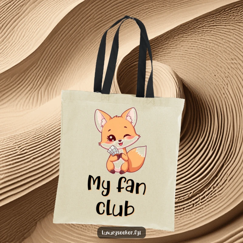 Funny tote bag featuring a happy fox holding a delicate fan, looking back playfully over its shoulder with a hint of a smile.