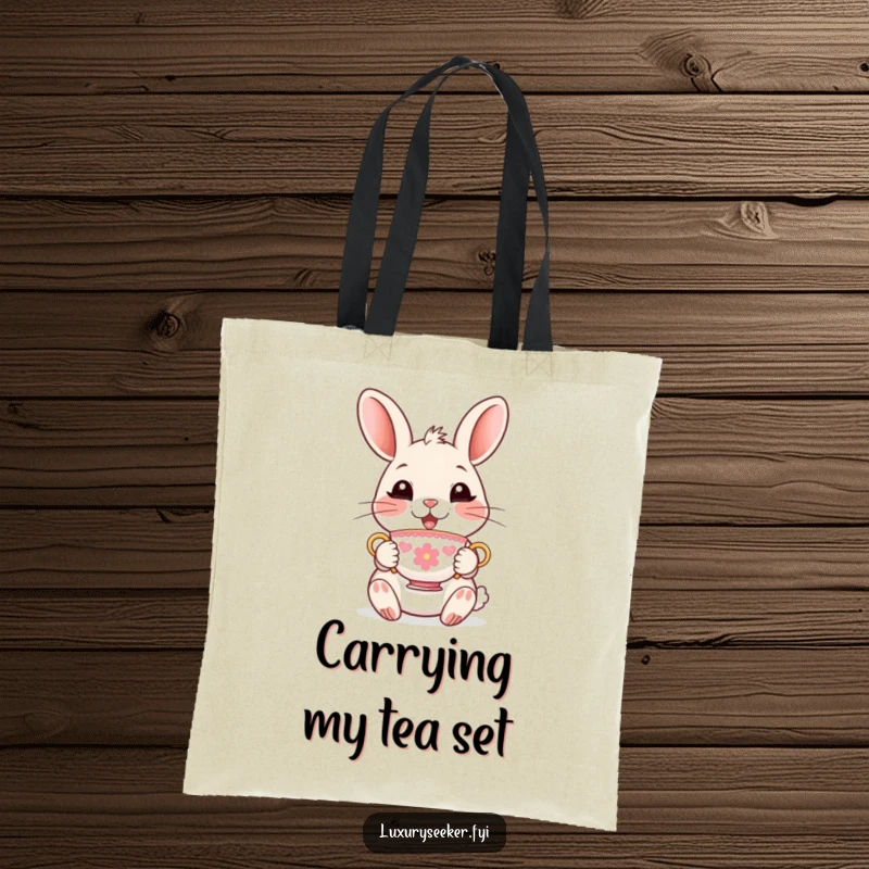 Funny Tote Bag showcasing a delighted rabbit character holding a tiny, ornate teacup, ideal for carrying items with chic humor.
