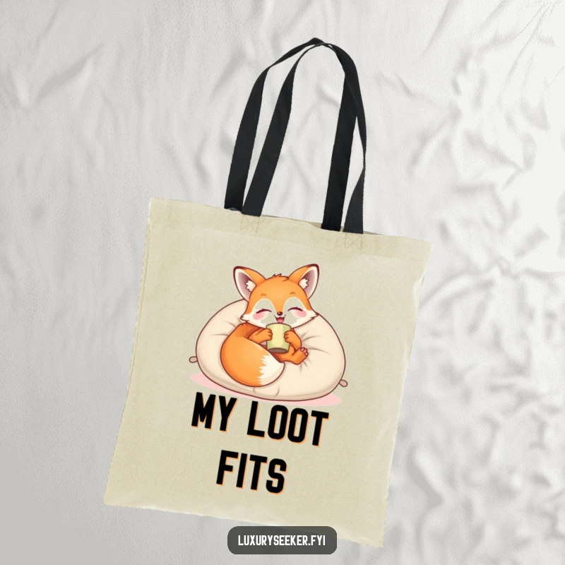 Funny Tote Bag: A joyful fox lounges on a plush velvet pillow with a cup, perfect for carrying essentials with relaxed, cozy style.